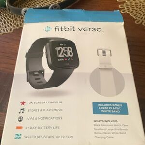 Fitbit versa watch w extra wrist band, charger.